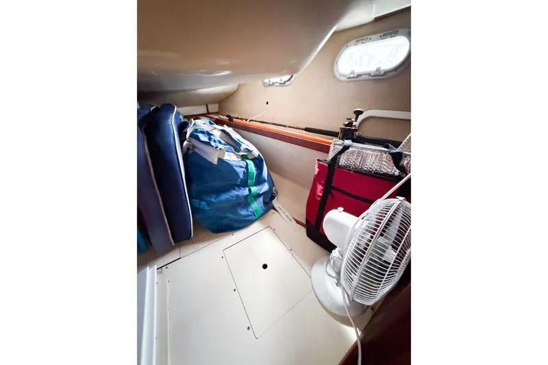 Slide: The Image of Interior cabin of a 1996 Hunter 430 sailboat with storage and fan. - 41