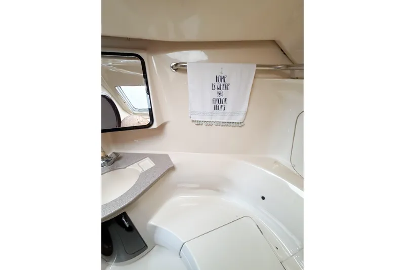 Slide: The Image of Interior of 1996 Hunter 430 sailboat bathroom with towel and mirror. - 44
