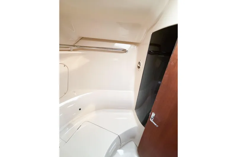 Slide: The Image of Interior of a 1996 Hunter 430 yacht bathroom with sleek design and wooden door. - 46