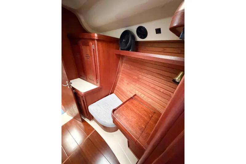 Slide: The Image of Interior of 1996 Hunter 430 sailboat with wooden cabinetry and seating area. - 50