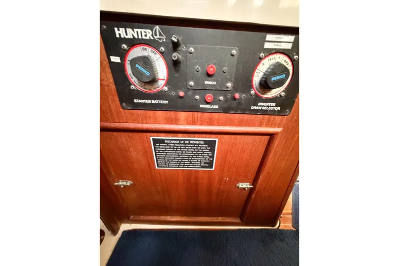 Slide: The Image of Control panel of a 1996 Hunter 430 sailboat with battery and inverter selectors. - 58