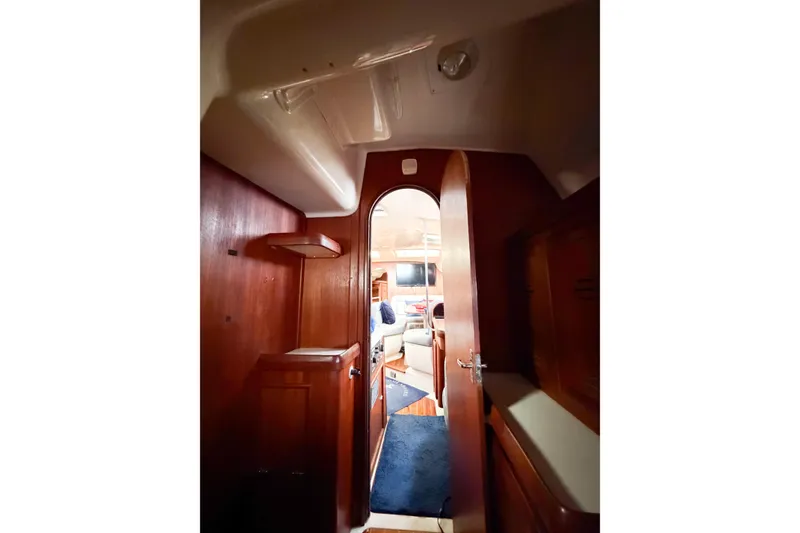 Slide: The Image of Interior view of 1996 Hunter 430 sailboat cabin with wooden finish. - 61