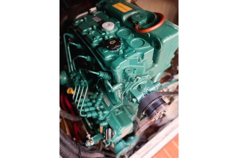 Slide: The Image of Engine of a 1996 Hunter 430 sailboat, showcasing intricate mechanical components. - 71