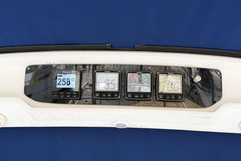 Slide: The Image of Control panel of a 1996 Hunter 430 sailboat with navigational instruments. - 81