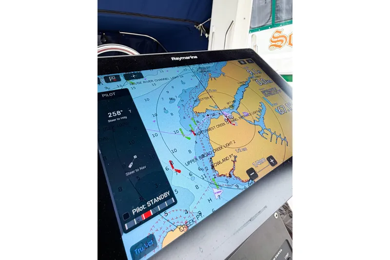 Slide: The Image of Navigation display on a 1996 Hunter 430 sailboat, showing nautical chart and course details. - 82