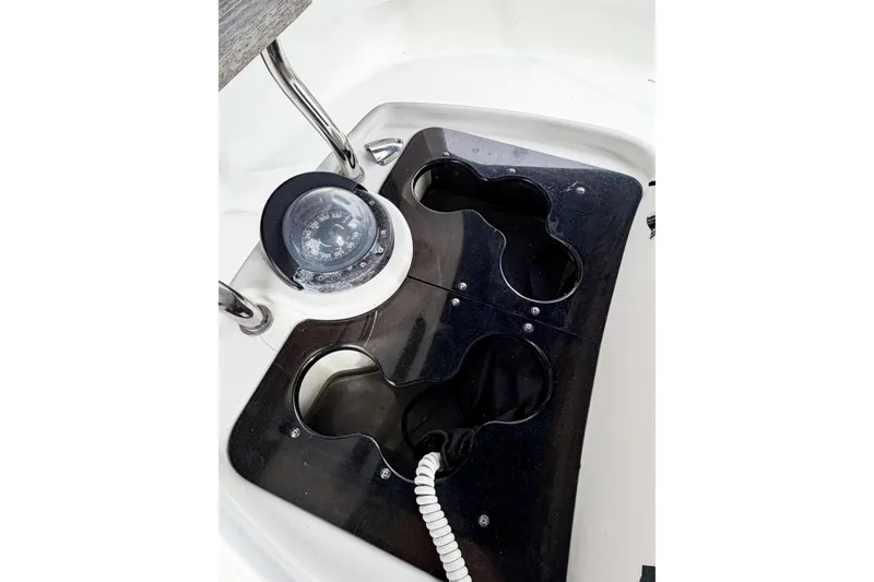 Slide: The Image of Compass and cup holders on a 1996 Hunter 430 sailboat deck. - 83
