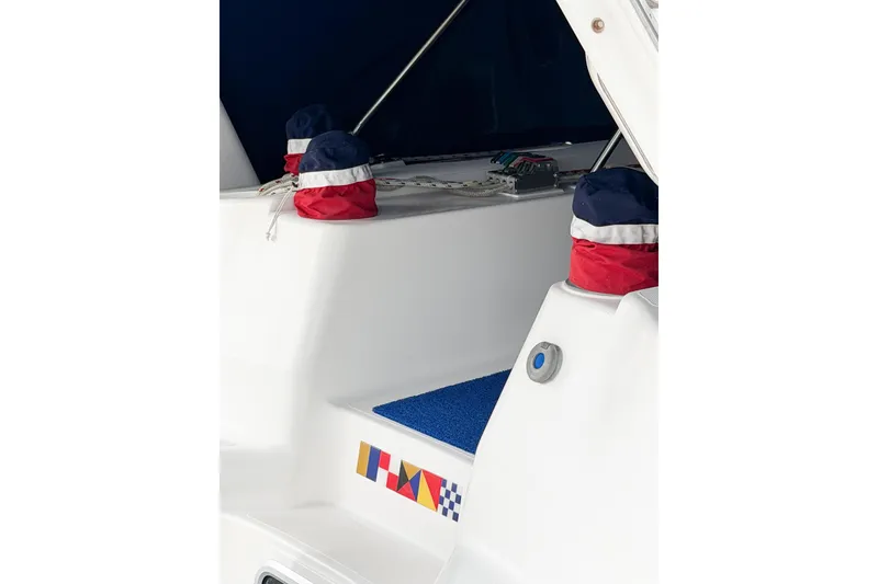 Slide: The Image of Hunter 430 sailboat deck detail, featuring colorful winch covers and nautical graphics, 1996 model. - 91