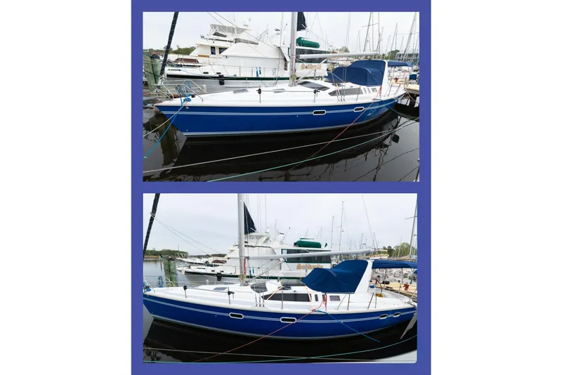 Slide: The Image of Hunter 430 sailboat from 1996 docked at a marina, featuring a blue hull. - 93