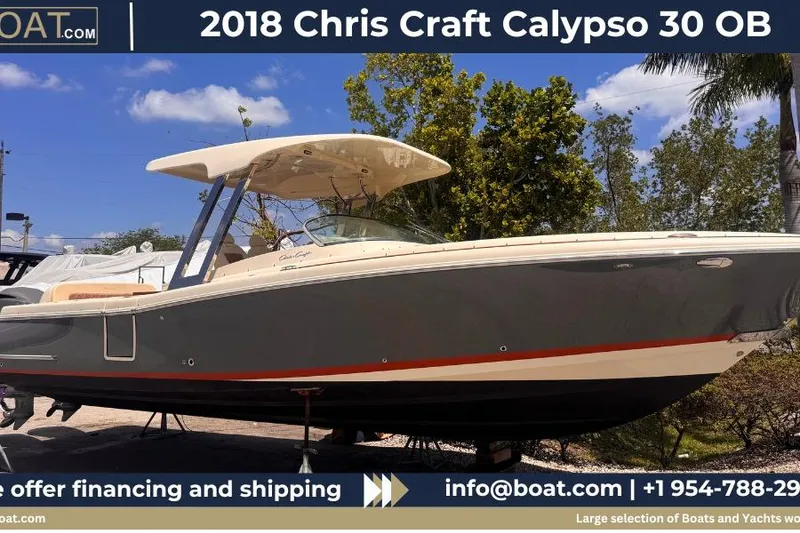 The Image of 2018 Chris-Craft Calypso 30 boat displayed outdoors with trees in the background. - 0
