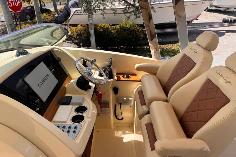 Slide: The Image of 2018 Chris-Craft Calypso 30 helm with Garmin display and luxurious seating. - 10