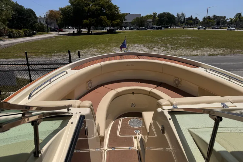 Slide: The Image of 2018 Chris-Craft Calypso 30 boat interior with seating and deck view. - 14