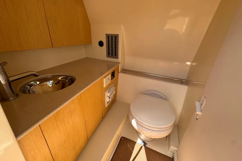 Slide: The Image of 2018 Chris-Craft Calypso 30 boat bathroom with sink and toilet. - 15