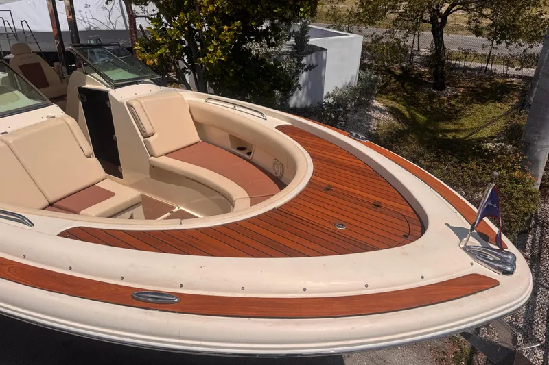 Slide: The Image of 2018 Chris-Craft Calypso 30 boat with elegant teak deck and comfortable seating. - 4