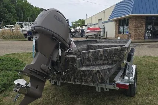 Slide: The Image of 2026 Havoc 1760 VJST boat with Yamaha outboard motor on trailer, parked outdoors. - 14