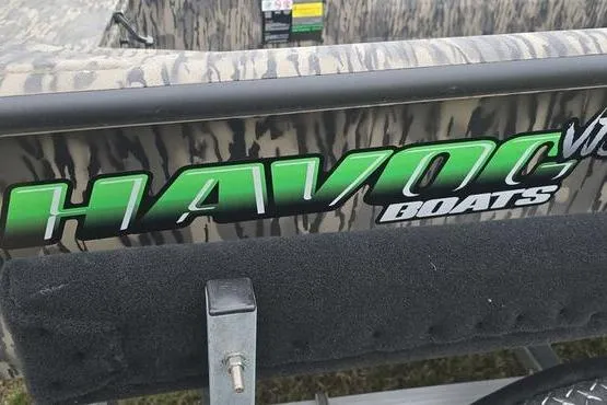 Slide: The Image of 2026 Havoc 1760 VJST boat with camouflage design and green logo. - 15