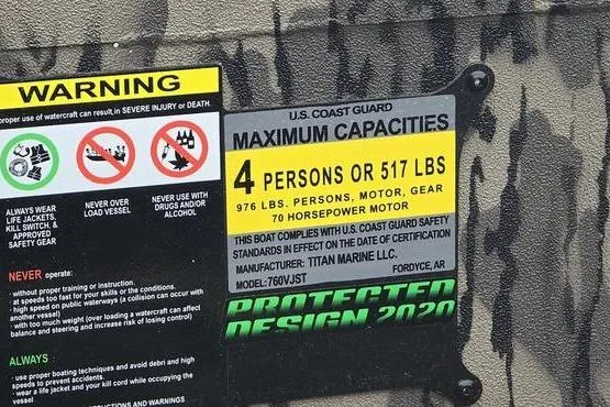 Slide: The Image of Warning label on Havoc 1760 VJST boat, 2026 model, showing capacity and safety instructions. - 16