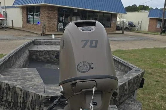 Slide: The Image of 2026 Havoc 1760 VJST boat with Yamaha 70 engine, parked outside a building. - 5