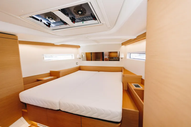 Slide: The Image of Luxurious interior of 2023 Jeanneau Sun Odyssey 490 yacht cabin with modern design. - 29