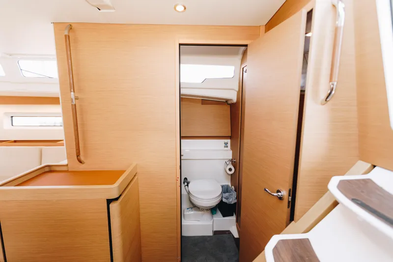 Slide: The Image of Interior of 2023 Jeanneau Sun Odyssey 490 yacht, featuring a compact bathroom. - 31