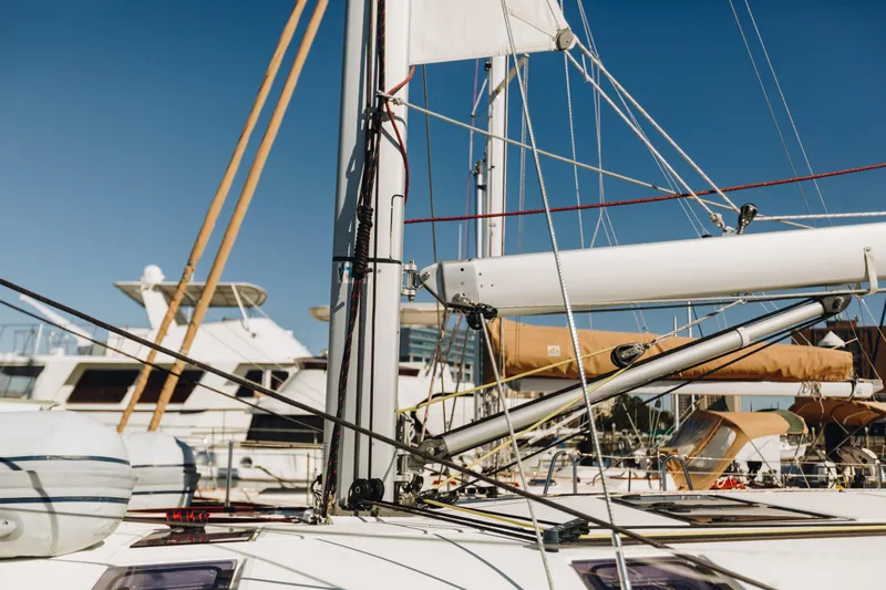 Slide: The Image of 2023 Jeanneau Sun Odyssey 490 sailboat mast and rigging in marina. - 9