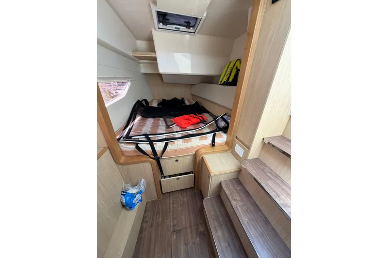 Slide: The Image of Interior cabin of 2018 Aquila 36 Sport boat with bed and storage. - 10