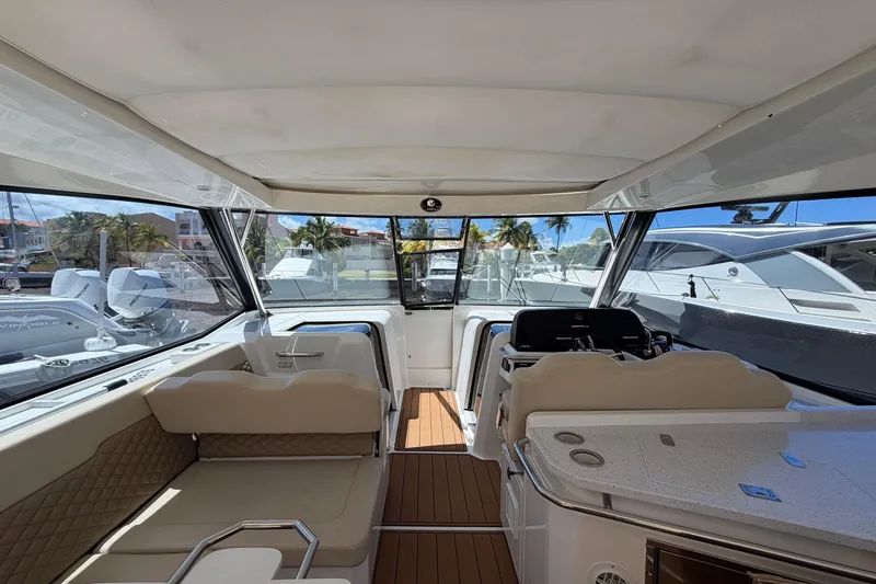 Slide: The Image of Interior view of 2018 Aquila 36 Sport yacht, featuring luxurious seating and helm station. - 3