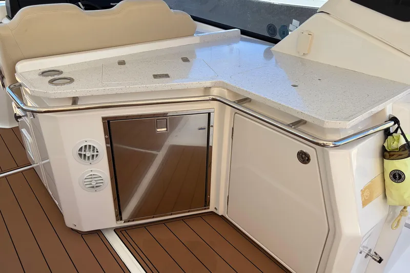 Slide: The Image of Aquila 36 Sport 2018 yacht interior with sleek countertop and stainless steel accents. - 6