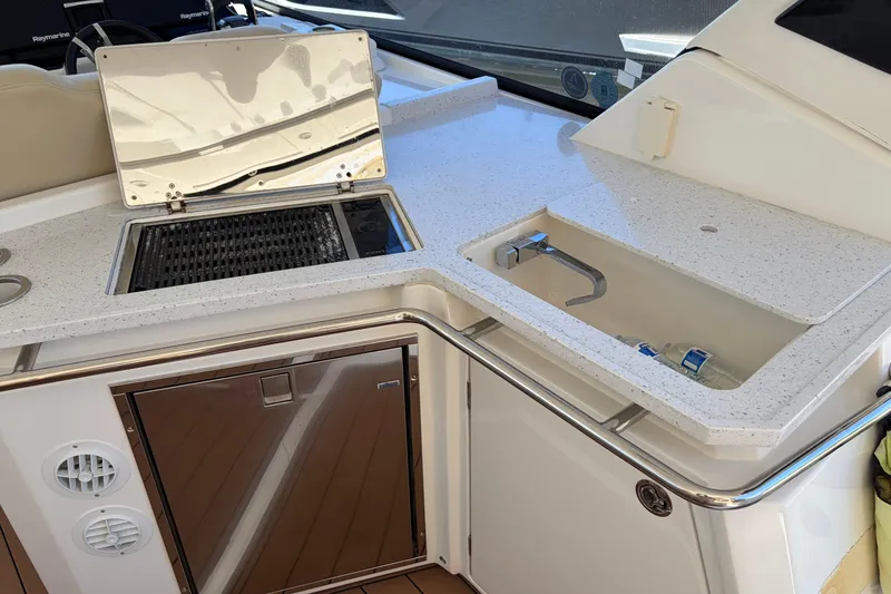 Slide: The Image of Outdoor kitchen area on 2018 Aquila 36 Sport yacht with sink and grill. - 7