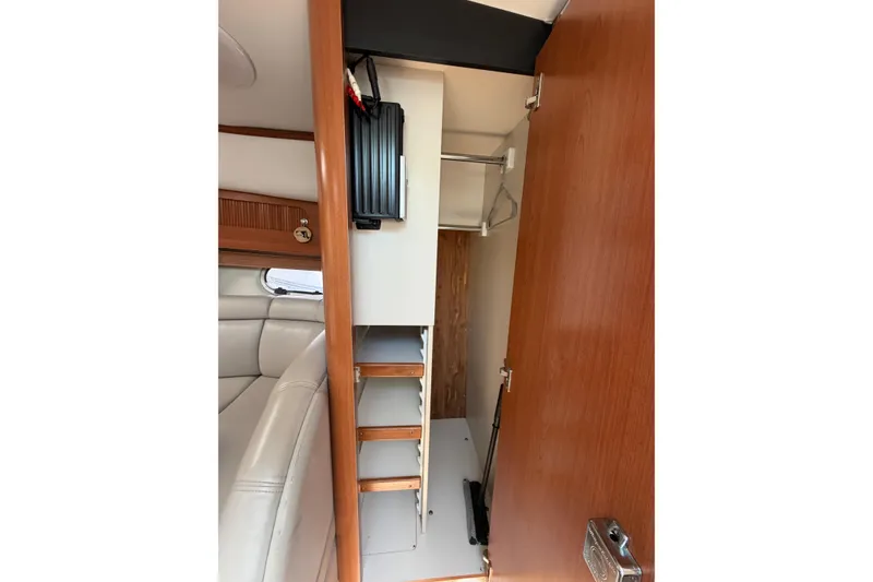 Slide: The Image of Interior view of 2003 Four Winns 328 Vista boat cabin with storage and seating. - 25