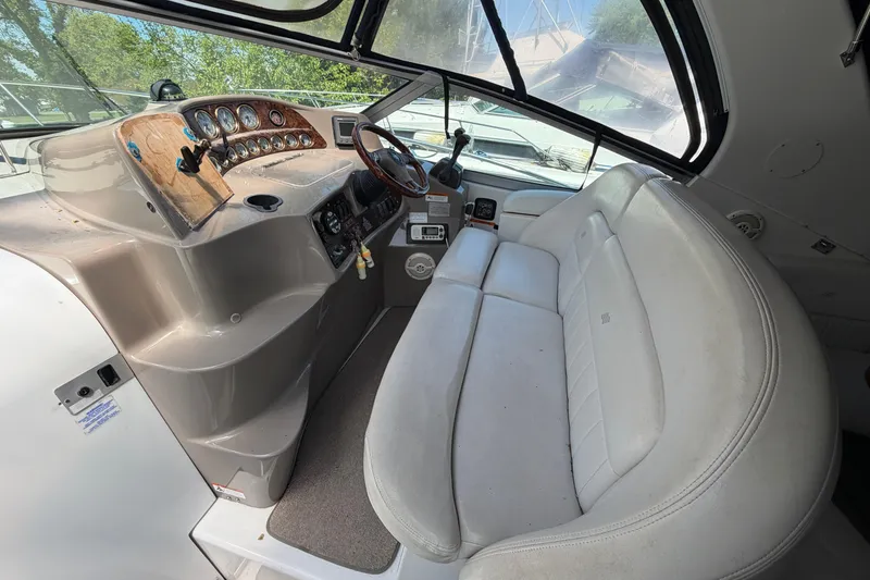 Slide: The Image of Interior cockpit of 2003 Four Winns 328 Vista boat with steering wheel and dashboard. - 6