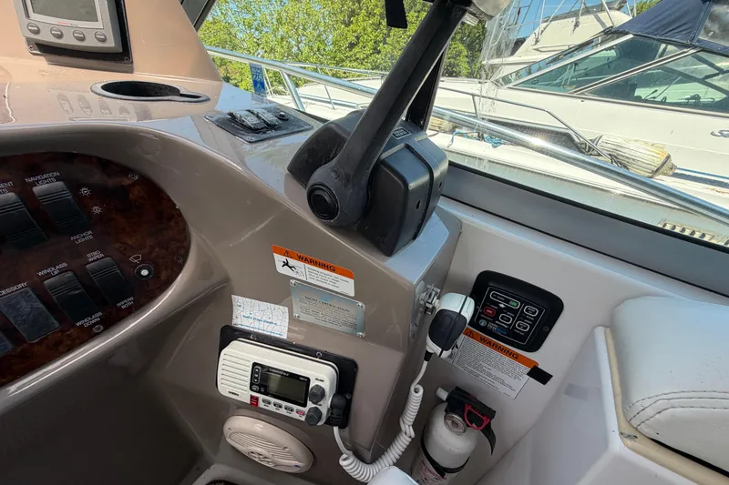 Slide: The Image of 2003 Four Winns 328 Vista boat cockpit with control panel and navigation equipment. - 8