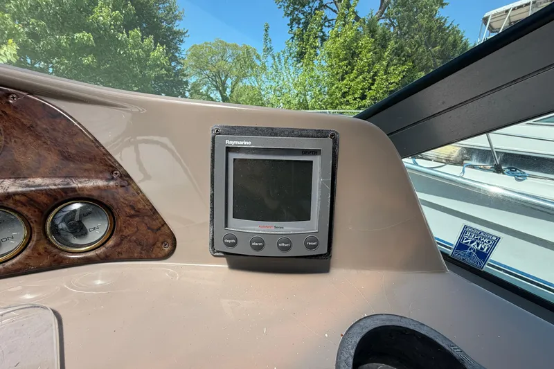 Slide: The Image of Control panel of a 2003 Four Winns 328 Vista boat with Raymarine display. - 9
