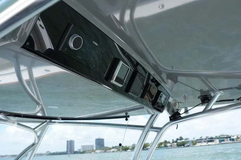 Slide: The Image of 2022 Valhalla Boatworks V-41 helm electronics with ocean view background. - 12