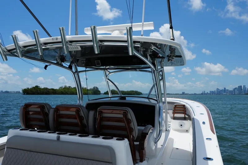 Slide: The Image of 2022 Valhalla Boatworks V-41 on water, city skyline in background, clear blue sky. - 14