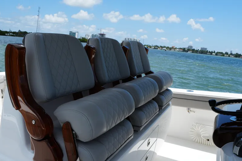 Slide: The Image of 2022 Valhalla Boatworks V-41 interior with luxurious seating, overlooking serene waters. - 15