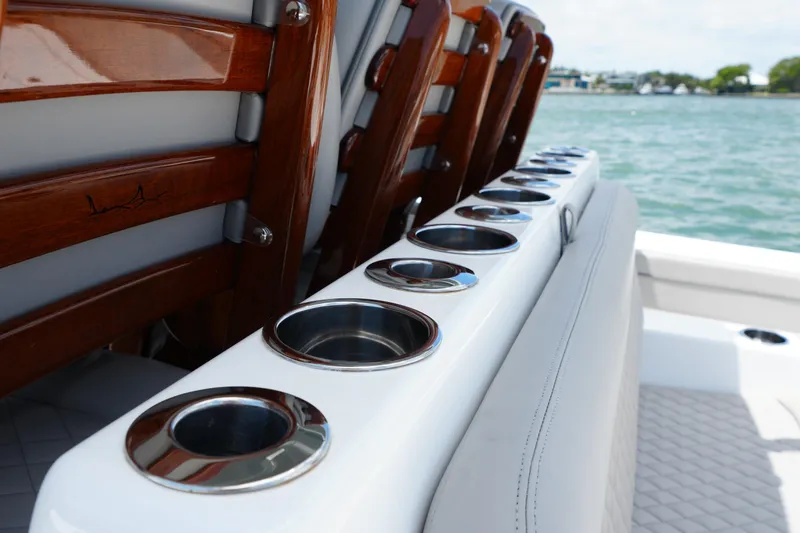 Slide: The Image of 2022 Valhalla Boatworks V-41 interior with polished cup holders and wooden accents. - 17