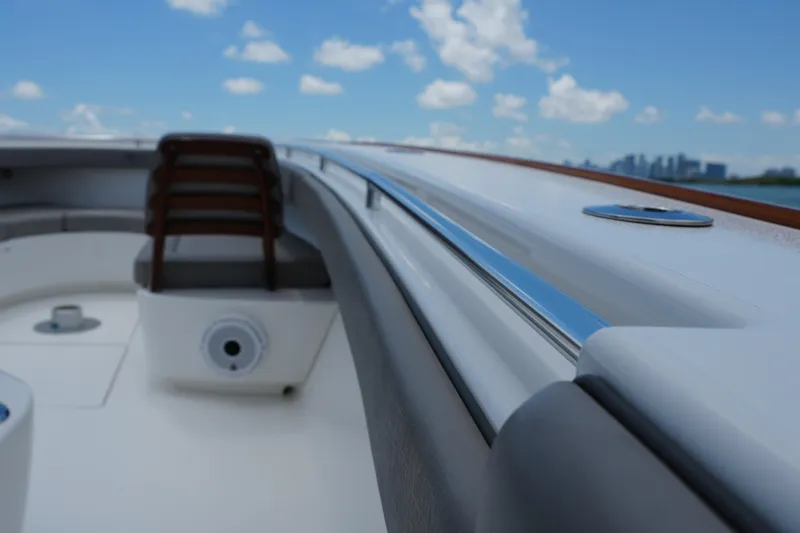 Slide: The Image of 2022 Valhalla Boatworks V-41 interior with seating, sleek design, and ocean view. - 19