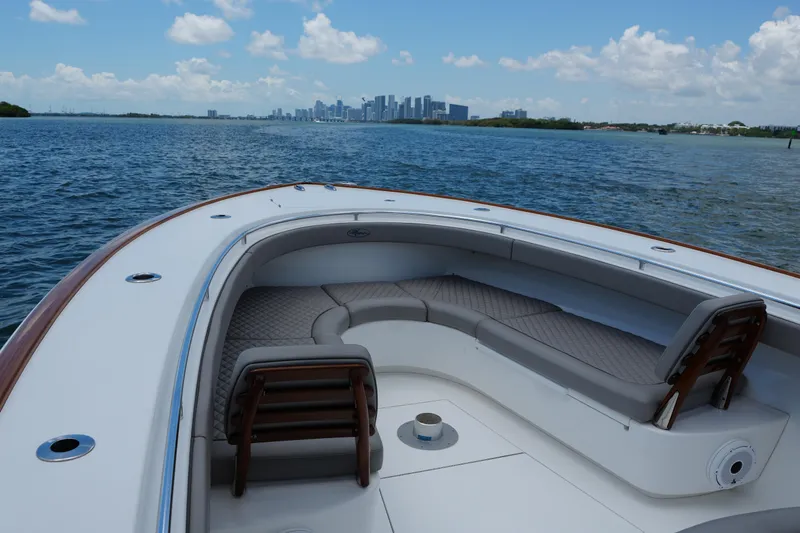 Slide: The Image of 2022 Valhalla Boatworks V-41 with spacious seating, cruising near city skyline. - 22