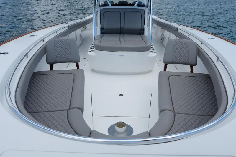 Slide: The Image of 2022 Valhalla Boatworks V-41 interior with luxurious seating and sleek design on the water. - 23
