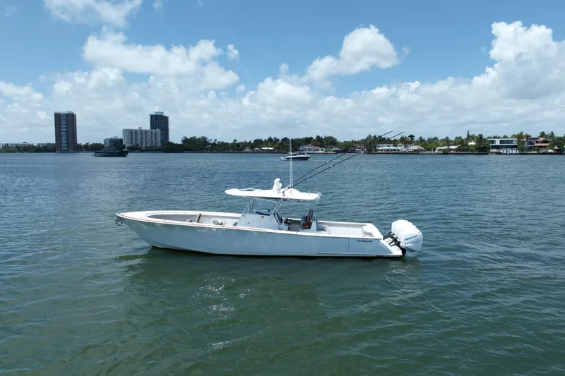 Slide: The Image of 2022 Valhalla Boatworks V-41 on calm water, city skyline in background. - 3