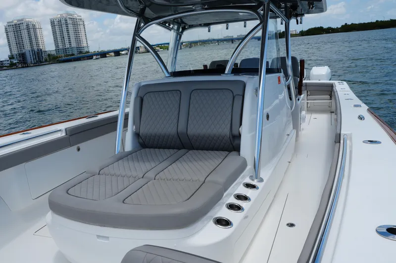 Slide: The Image of 2022 Valhalla Boatworks V-41 with sleek seating, cruising on a scenic waterway. - 30