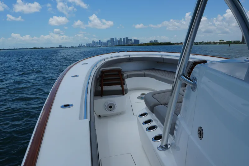 Slide: The Image of 2022 Valhalla Boatworks V-41 cruising on open water with city skyline in background. - 31