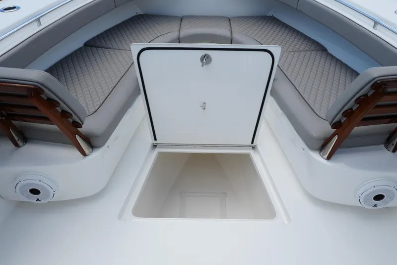 Slide: The Image of 2022 Valhalla Boatworks V-41 interior with cushioned seating and storage compartment. - 34