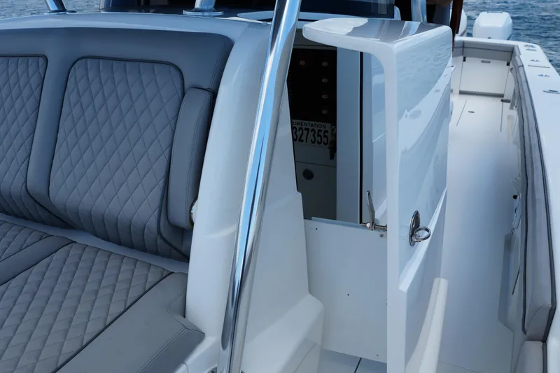 Slide: The Image of 2022 Valhalla Boatworks V-41 interior with quilted seating and open storage compartment. - 36