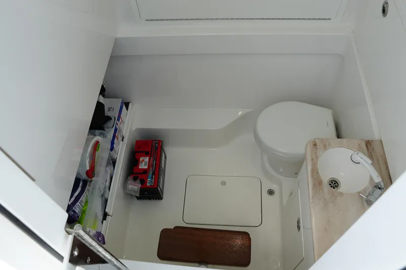 Slide: The Image of 2022 Valhalla Boatworks V-41 interior bathroom with toilet, sink, and storage. - 38