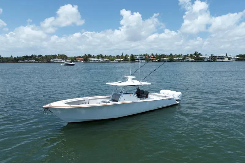 Slide: The Image of 2022 Valhalla Boatworks V-41 on calm water under a partly cloudy sky. - 4