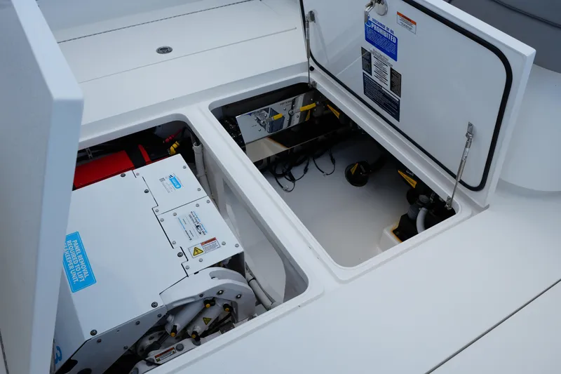 Slide: The Image of Engine compartment of 2022 Valhalla Boatworks V-41, showcasing mechanical components and storage. - 41