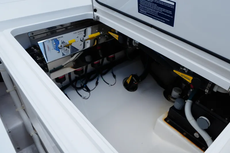 Slide: The Image of Engine compartment of 2022 Valhalla Boatworks V-41, showcasing mechanical components and wiring. - 43