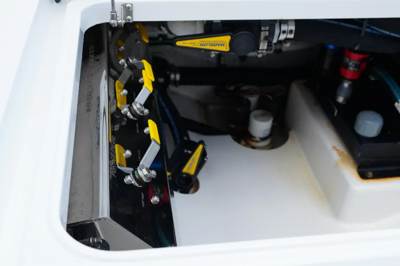 Slide: The Image of Engine compartment of 2022 Valhalla Boatworks V-41, showcasing control levers and components. - 45