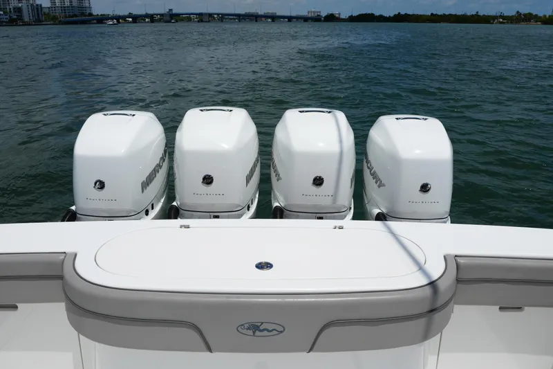 Slide: The Image of 2022 Valhalla Boatworks V-41 with four Mercury outboard engines on open water. - 48